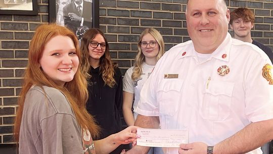 Flower Power: MHS Bomber Blooms Presents Donation to MFD for Grain Rescue Equipment