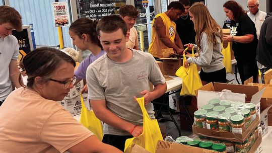 Kunes and Friends Pack 600 Food Kits in Record Time
