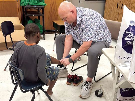 Brown's Shoe Fit Macomb, Noon Rotary Donate 55 'Kicks'