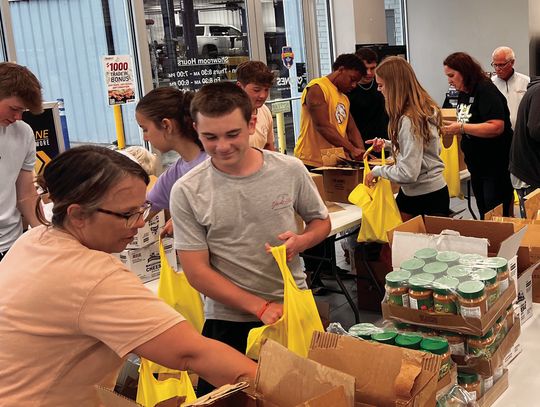Kunes and Friends Pack 600 Food Kits in Record Time