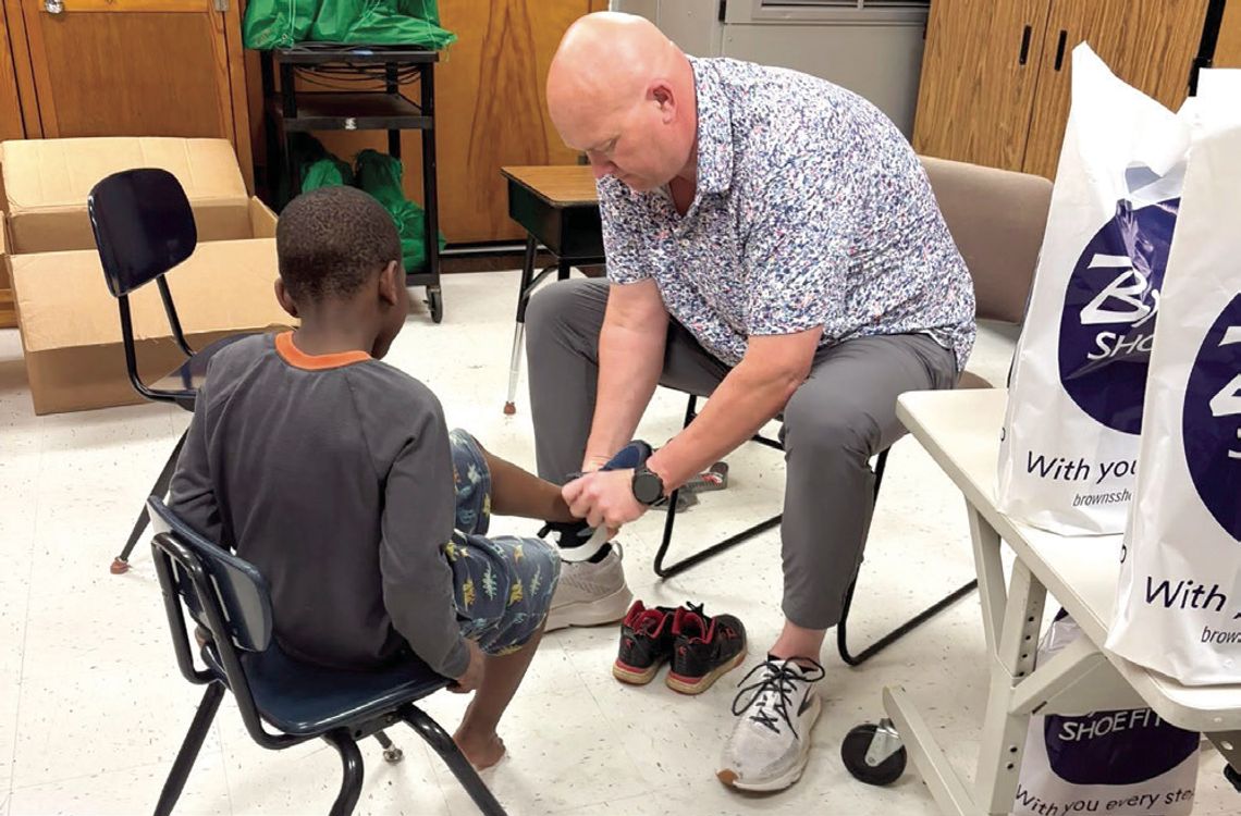Brown's Shoe Fit Macomb, Noon Rotary Donate 55 'Kicks'