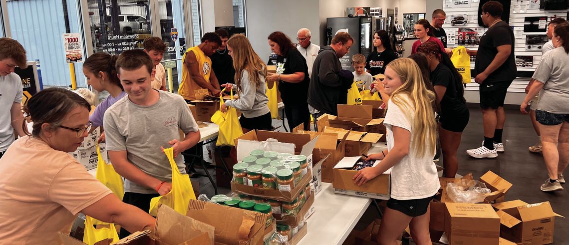Kunes and Friends Pack 600 Food Kits in Record Time Kunes and Friends Pack 600 Food Kits in Record Time